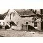 At one time a shingle mill was also attached to the grist mill. This is likely the small addition to the left of the main building. Date of photo is unknown.